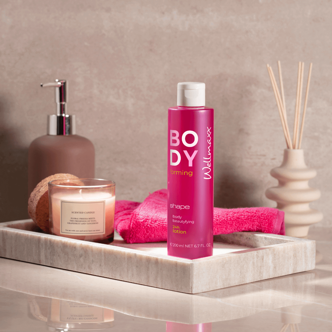 Wellmaxx shape body beautyfying 24h lotion on a spa tray with a candle and decor items, promoting skin elasticity and care.