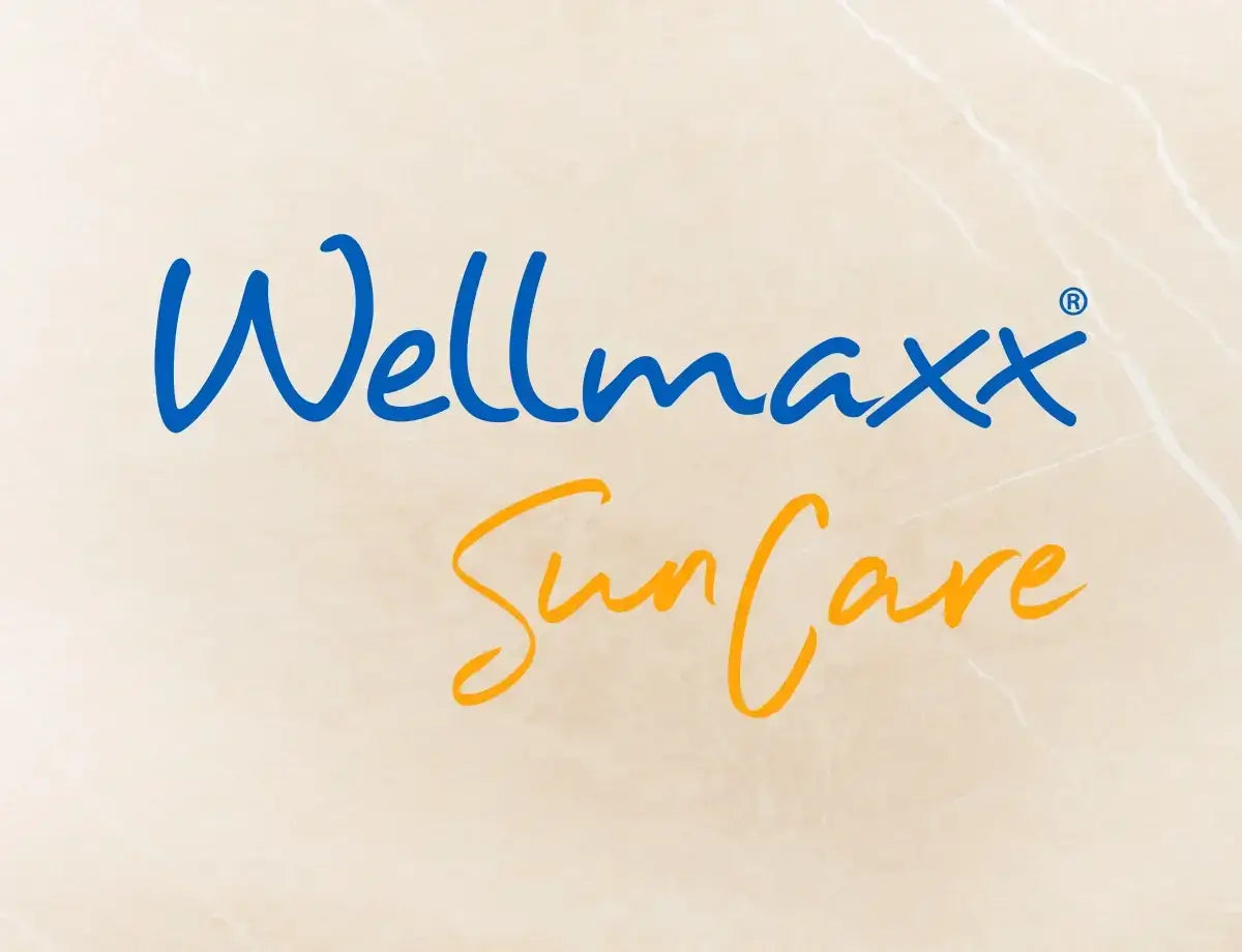 Wellmaxx SunCare logo on a light marble background highlighting skincare products.