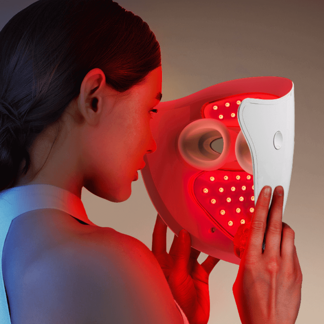 Woman using LiFTmee LED beauty mask for effective home light therapy treatment.